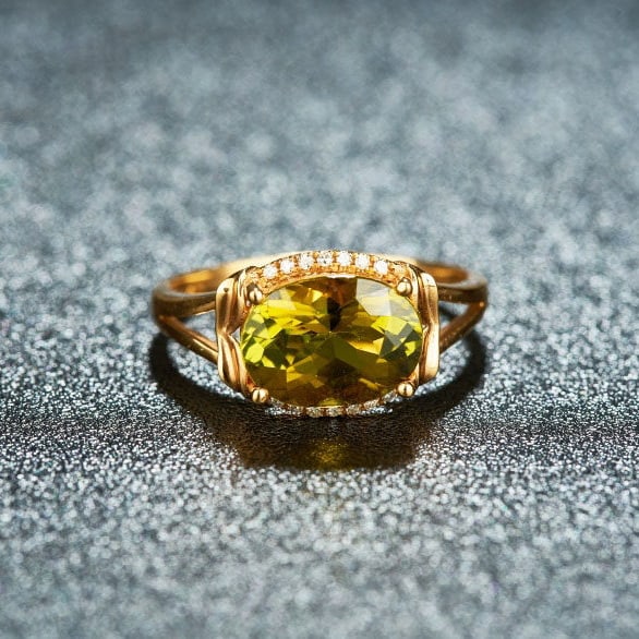 14k Gold 2.38 Ct Natural Tourmaline & Diamond Ring: Ref:231164257 // gold content:14k gold // ring size:7. 25us // // main gemstone:tourmaline // shape:oval // carat weight:2. 38ct // color:yellowish green // treatment:natural // // adjacent gemstone