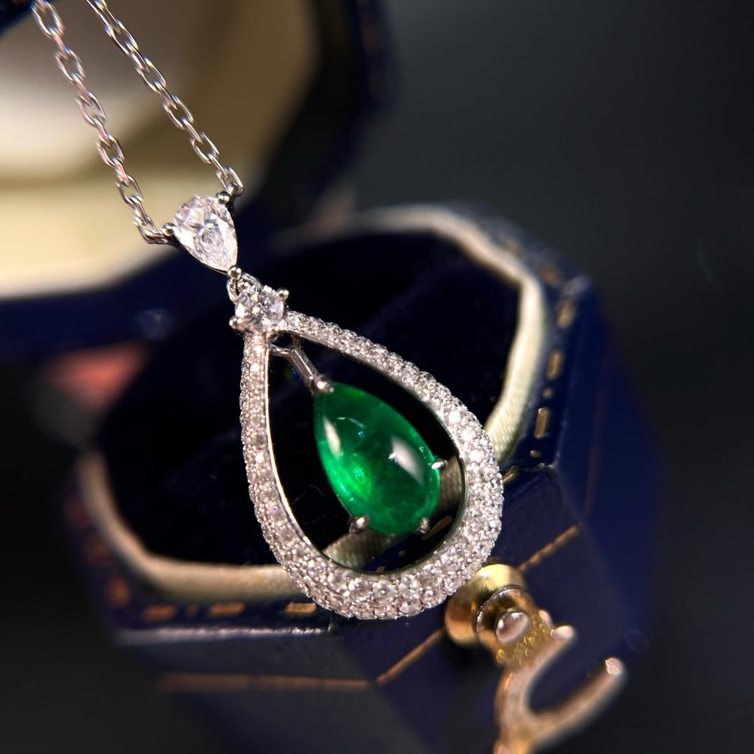 14k Gold 1.08 Ctw Vivid Green Natural Emerald & Diamond Pendant( Without Chain ): Ref:231164382 // gold content:14k gold // main gemstone:emerald // shape:pear // carat weight:0. 68ct // color:vivid green // treatment:natural // // adjacent gemstone 2 : diamond // shape:multiple
