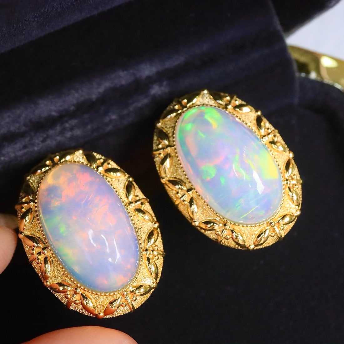 14k Gold 12.16 Ct Natural Opal Earrings: Ref:231164432 // gold content:14k gold // main gemstone:opal // shape:oval // carat weight:12. 16ct // color:color // treatment:natural // Low Estimate: 9200 Condition: New High Estimate: 14000