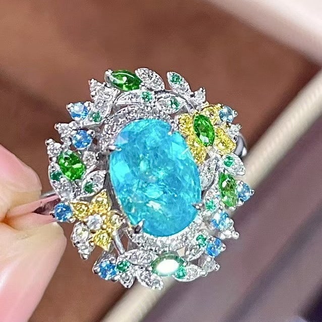 14k Gold 1.73 Ctw Natural Paraiba Tourmaline & Coloured Gemstone Ring: Ref:231165021 // gold content:14k gold // ring size:7. 25us // // main gemstone:paraiba tourmaline // shape:oval // carat weight:1. 23ct // color:blue // treatment:natural // // adjacent gemstone 2 :