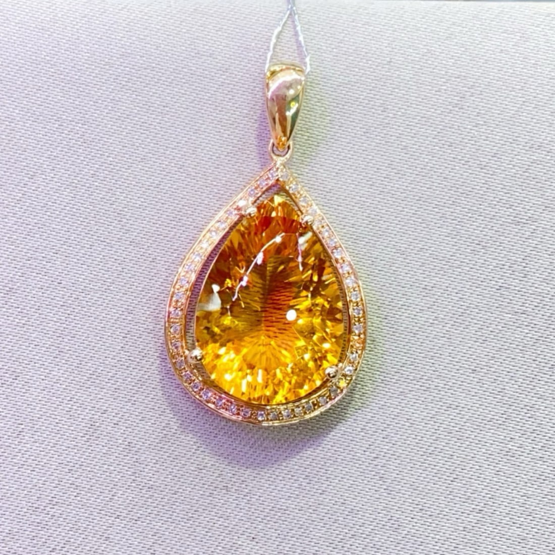 14k Gold 8.23 Ctw Natural Citrine & Diamond Pendant( Without Chain ): Ref:231165215 // gold content:14k gold // main gemstone:citrine // shape:pear // carat weight:8. 1ct // color:yellow // treatment:natural // // adjacent gemstone 2 : diamond // number of stones:45 //