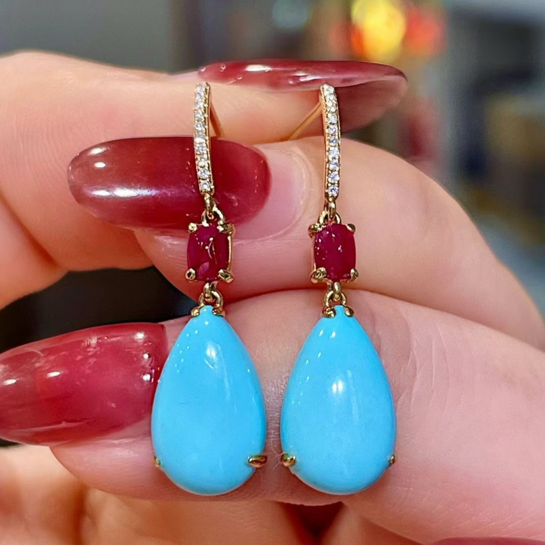 14k Gold 5.41 Ctw Natural Blue Turquoise & Ruby Earrings: Ref:231165254 // gold content:14k gold // main gemstone:blue turquoise // shape:pear // carat weight:4. 98ct // color:blue // treatment:natural // // adjacent gemstone 2 : ruby // shape:sugar-loaf //