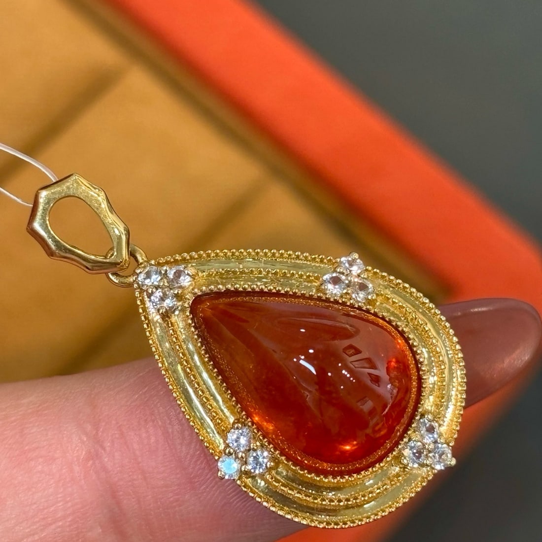 14k Gold 7 Ct Natural Spessartine & Sapphire Pendant( Without Chain ): Ref:231166191 // gold content:14k gold // main gemstone:spessartine // shape:pear // carat weight:7ct // color:orange // treatment:natural // // adjacent gemstone 2 : sapphire // shape:round //