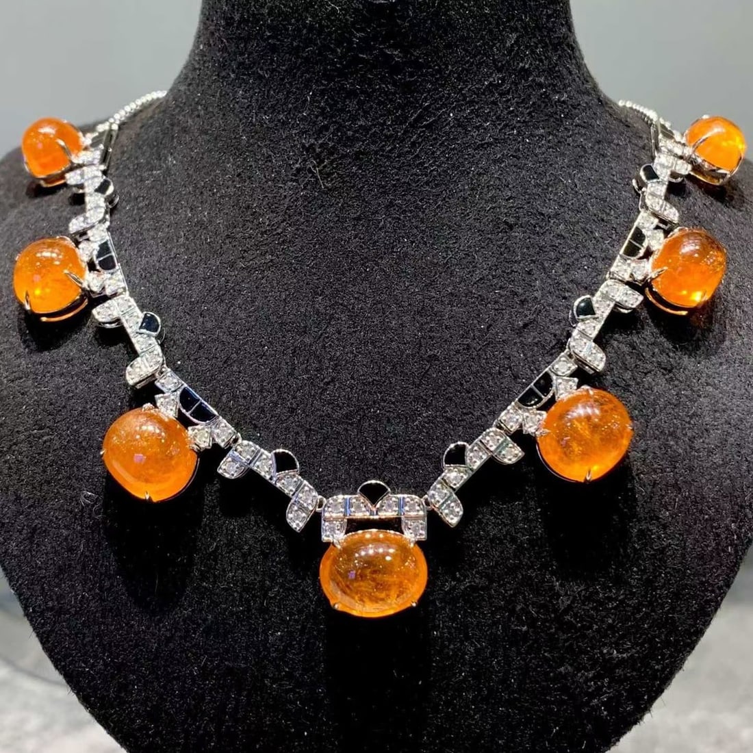 14k Gold 43.5 Ct Natural Spessartine & Diamond Necklace: Ref:231169021 // gold content:14k gold // main gemstone:spessartine // number of stones:7 // shape:oval // carat weight:43. 5ct // color:orange // treatment:natural // // adjacent gemstone 2 :