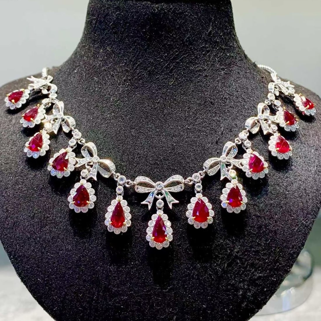 14k Gold 6.8 Ct Natural Ruby & Diamond Necklace: Ref:231169031 // gold content:14k gold // main gemstone:ruby // number of stones:13 // shape:pear // carat weight:6. 8ct // color:red // treatment:natural // // adjacent gemstone 2 : diamond // shape: