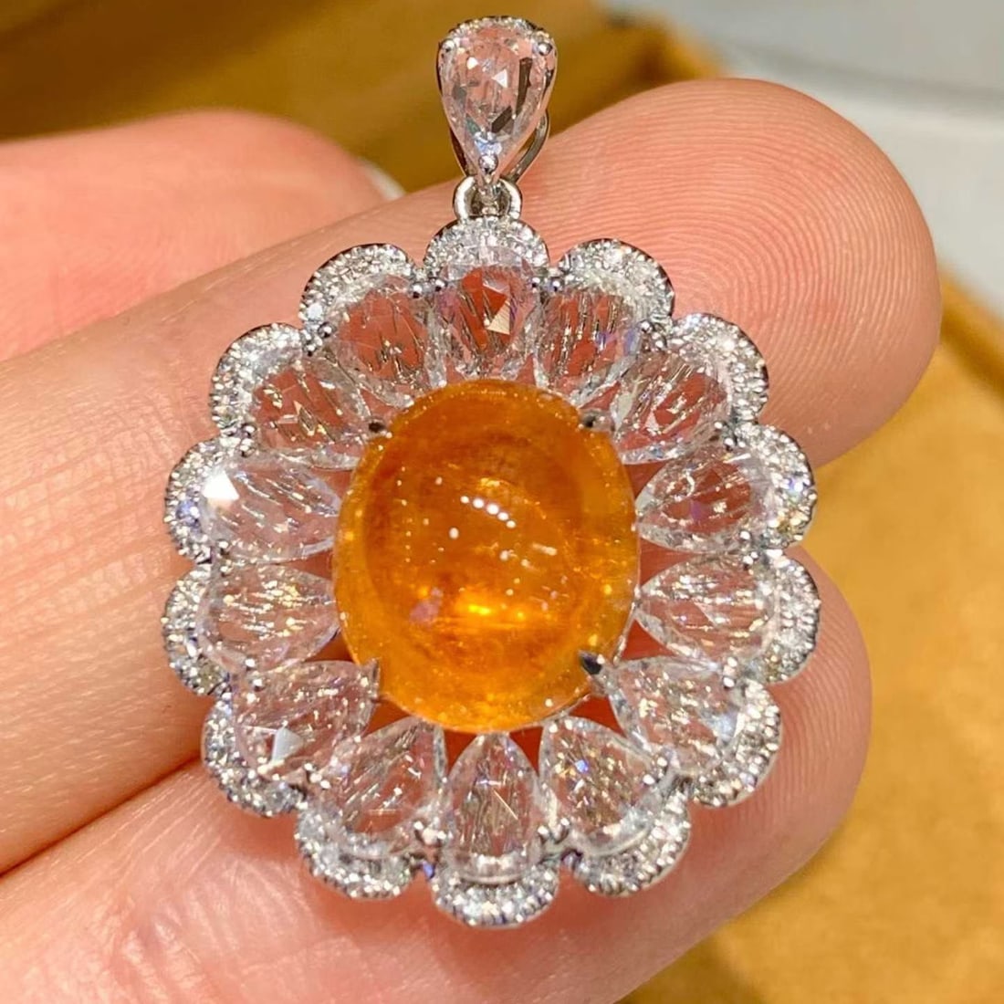 14k Gold 5.2 Ct Natural Spessartine & Sapphire & Diamond Pendant( Without Chain ): Ref:231169062 // gold content:14k gold // main gemstone:spessartine // shape:oval // carat weight:5. 2ct // color:orange // treatment:natural // // adjacent gemstone 2 : sapphire // shape:pear //