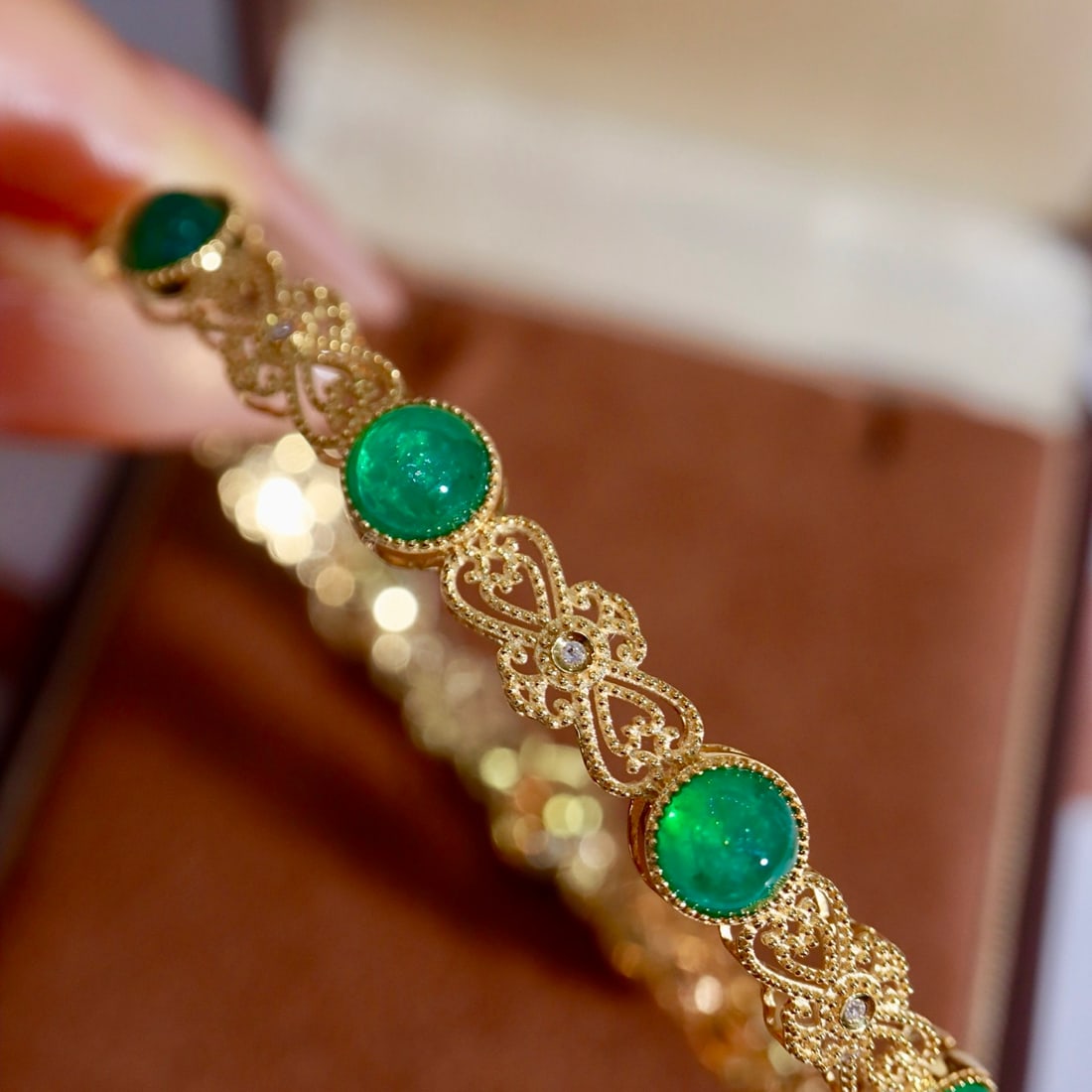 14k Gold 8.24 Ctw Natural Emerald & Diamond Bangle: Ref:231169128 // gold content:14k gold // main gemstone:emerald // shape:round // carat weight:8. 2ct // color:green // treatment:natural // cut grade:g // // adjacent gemstone 2 : diamond // shape:ro