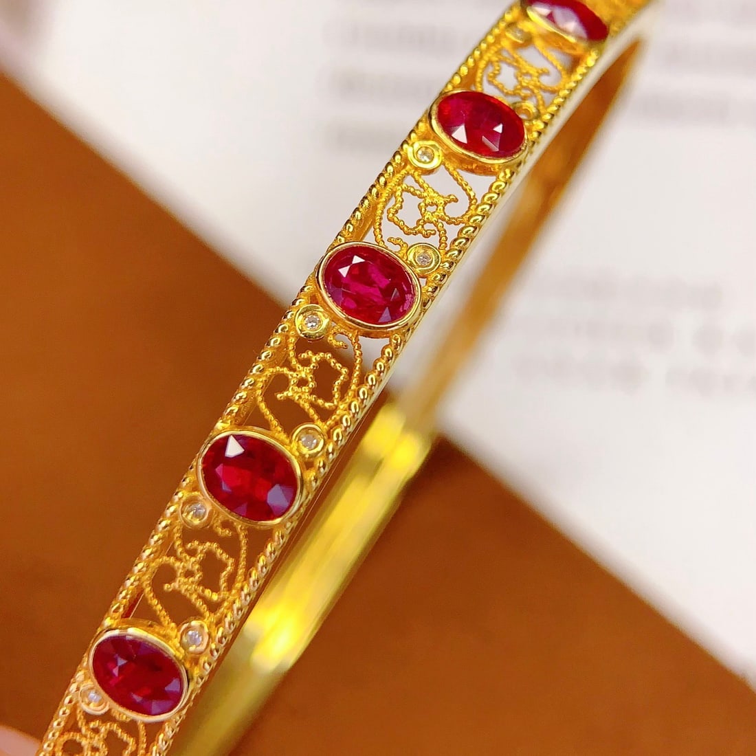 14k Gold 3 Ct Natural Ruby & Diamond Bangle: Ref:231169178 // gold content:14k gold // main gemstone:ruby // shape:oval // carat weight:3ct // color:red // treatment:natural // // adjacent gemstone 2 : diamond // number of stones:16 // shape:rou