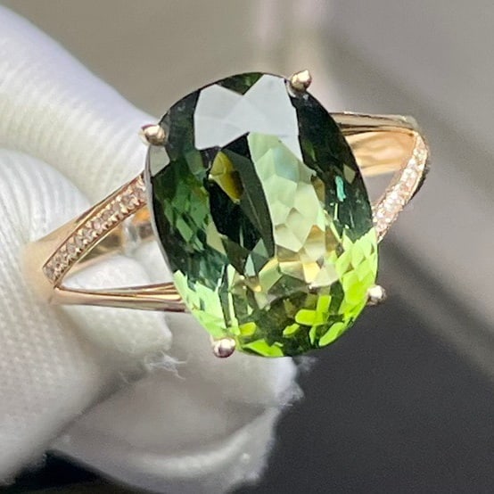 14k Gold 6.25 Ct Natural Tourmaline & Diamond Ring: Ref:231169213 // gold content:14k gold // ring size:7. 25us // // main gemstone:tourmaline // shape:oval // carat weight:6. 25ct // color:green // treatment:natural // // adjacent gemstone 2 :