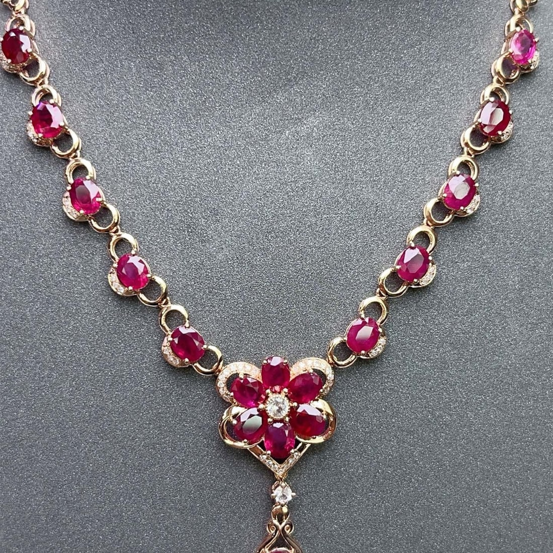 14k Gold 6.25 Ct Natural Ruby & Diamond & Sapphire Necklace: Ref:231170064 // gold content:14k gold // main gemstone:ruby // shape:oval // carat weight:6. 25ct // color:red // treatment:natural // // adjacent gemstone 2 : diamond // number of stones:54 // shape