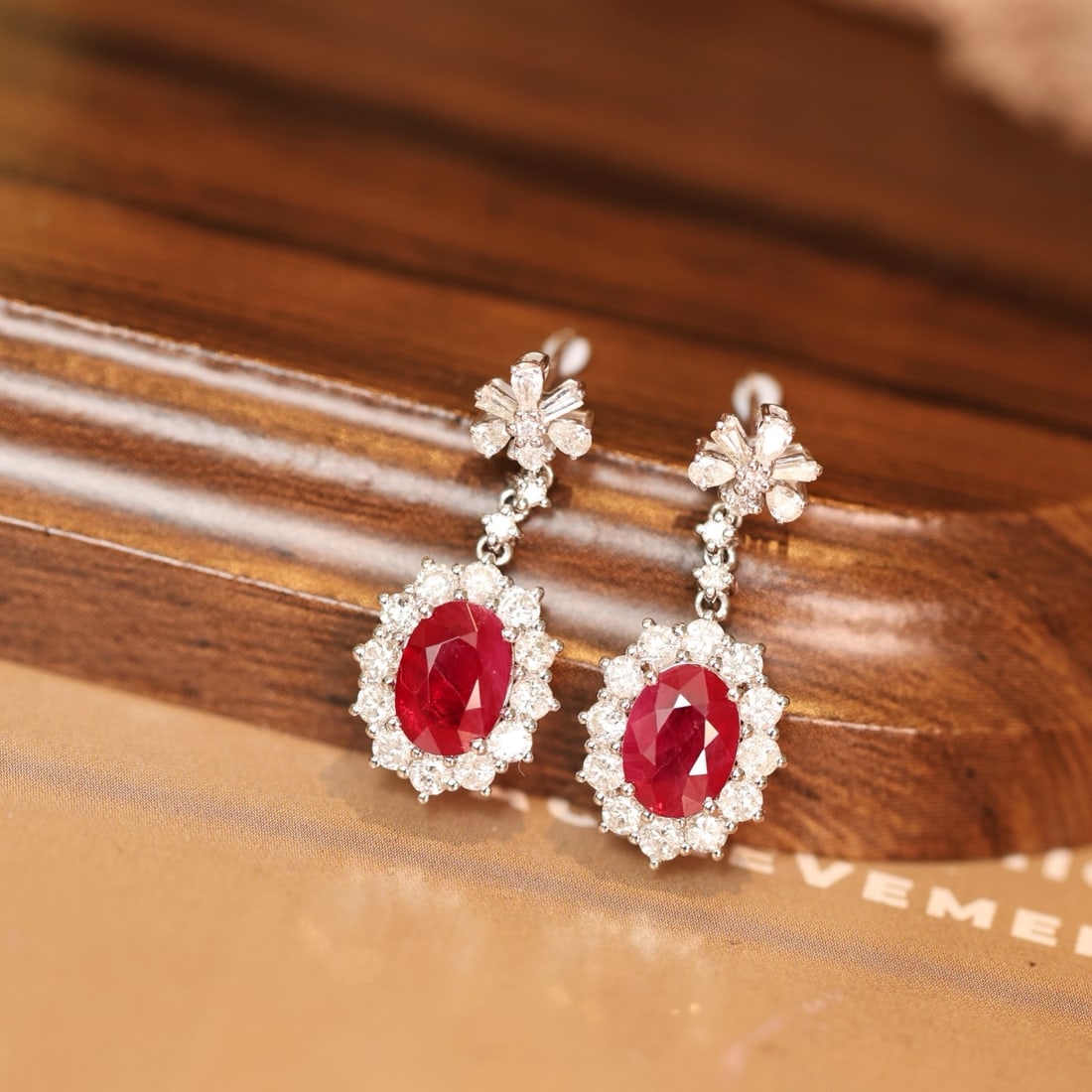 14k Gold 3.38 Ctw Vivid Red Natural Ruby & Diamond Earrings: Ref:231170090 // gold content:14k gold // main gemstone:ruby // shape:oval // carat weight:2. 22ct // color:vivid red // treatment:natural // // adjacent gemstone 2 : diamond // shape:multiple //