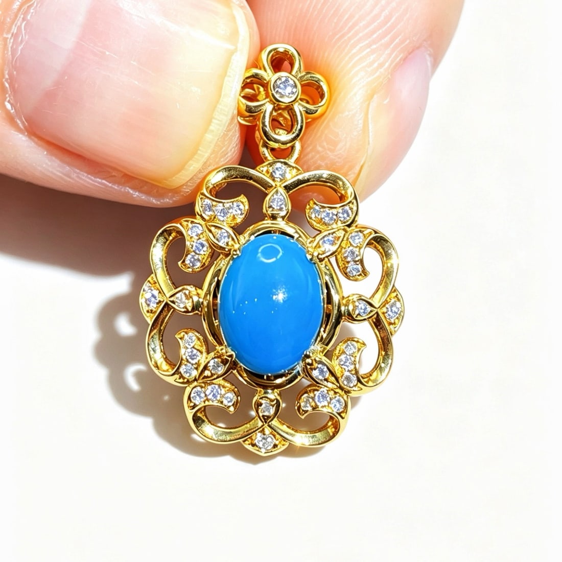 14k Gold 1.04 Ctw Natural Blue Turquoise & Diamond Pendant( Without Chain ): Ref:231170102 // gold content:14k gold // main gemstone:blue turquoise // shape:oval // carat weight:0. 91ct // color:blue // treatment:natural // // adjacent gemstone 2 : diamond // shape:round //