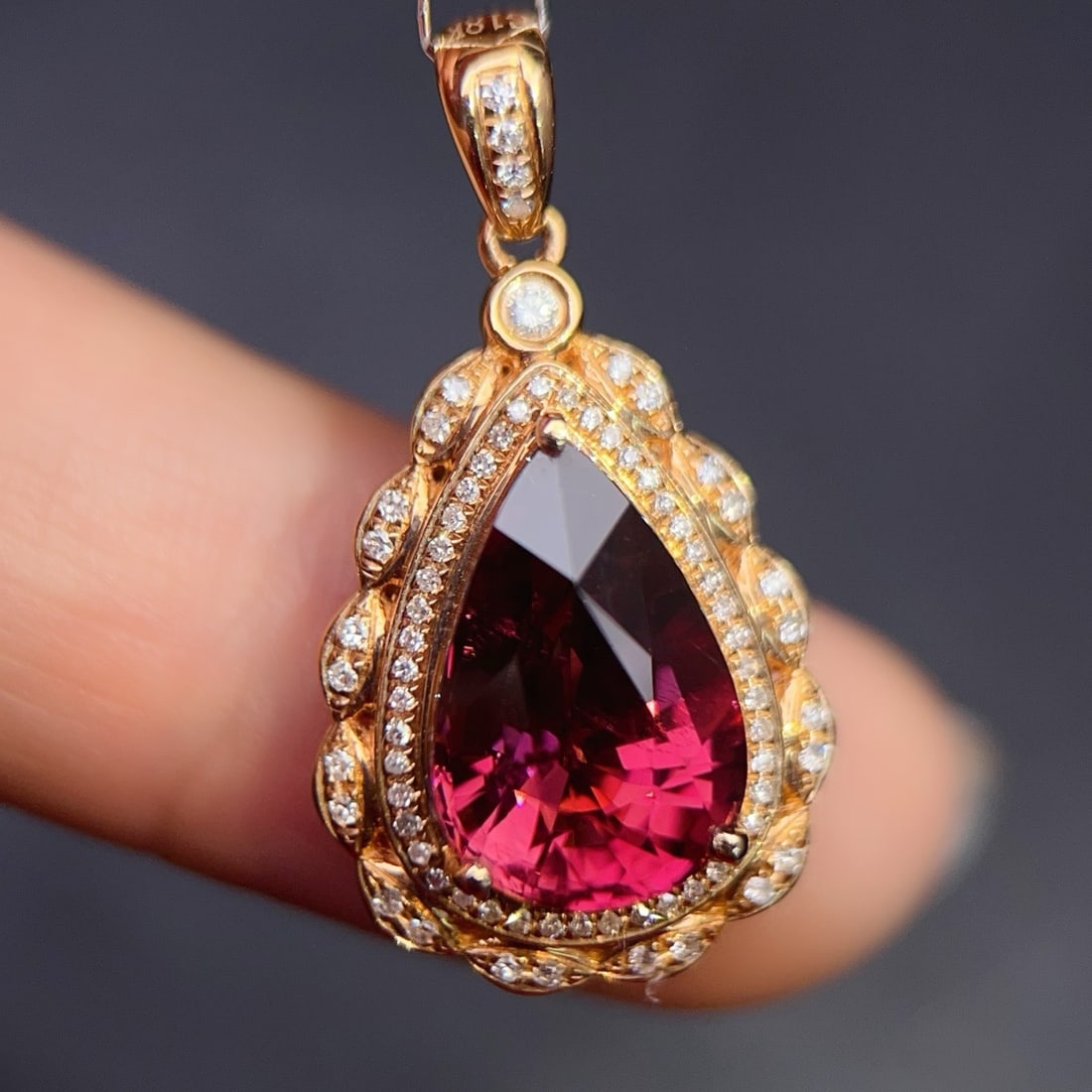 14k Gold 4.5 Ct Natural Tourmaline & Diamond Pendant( Without Chain ): Ref:231170140 // gold content:14k gold // main gemstone:tourmaline // shape:pear // carat weight:4. 5ct // color:red // treatment:natural // // adjacent gemstone 2 : diamond // number of stones:76 // 