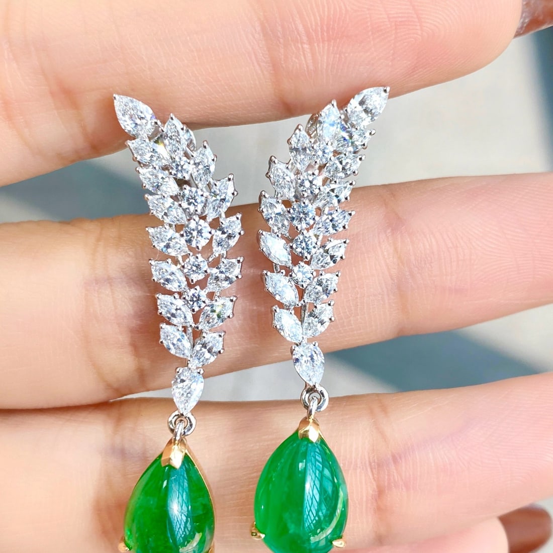 14k Gold 9.63 Ctw Vivid Green Natural Emerald & Diamond Earrings: Ref:231170242 // gold content:14k gold // main gemstone:emerald // shape:pear // carat weight:7. 29ct // color:vivid green // treatment:natural // // adjacent gemstone 2 : diamond // shape:multiple //