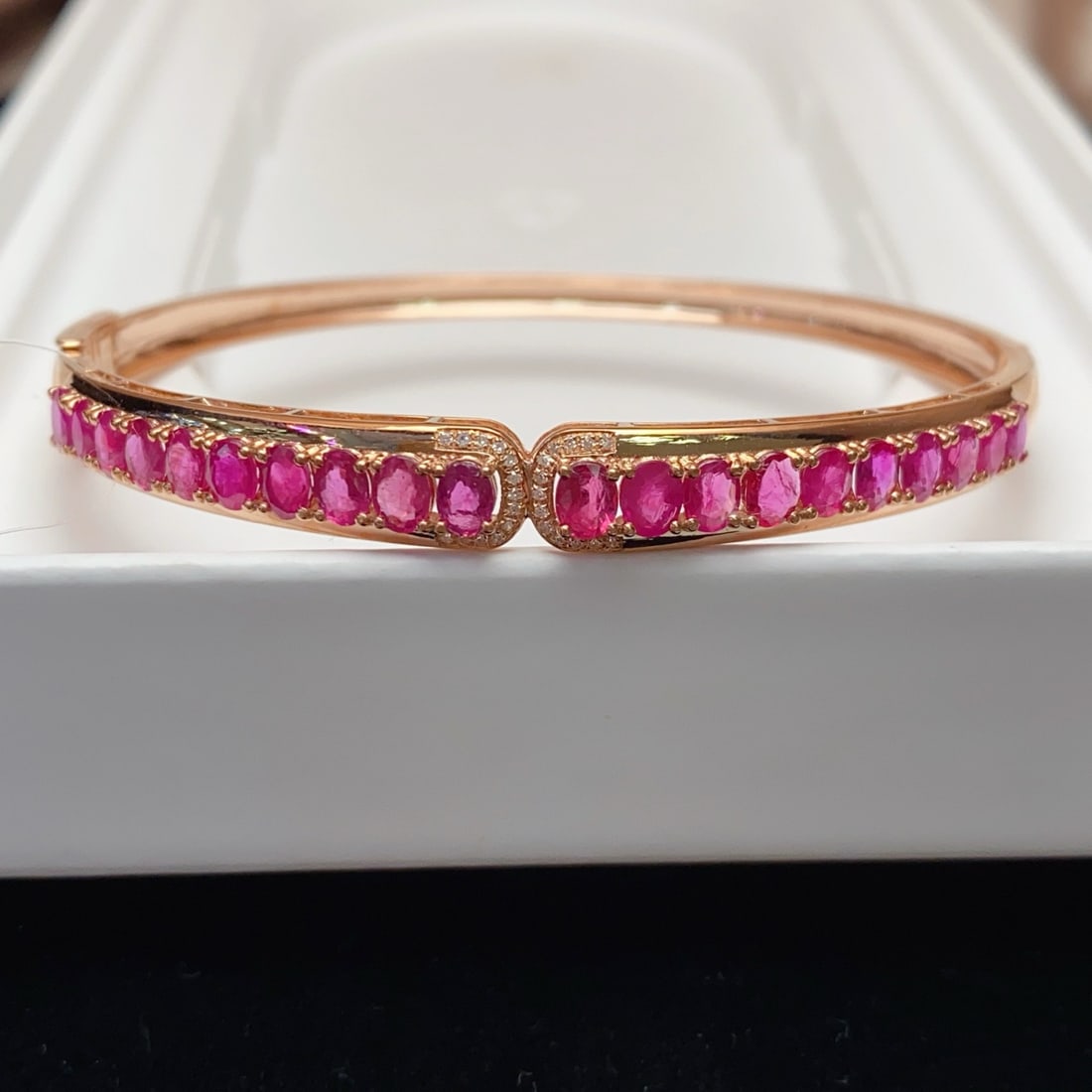 14k Gold 5.20 Ct Natural Ruby & Diamond Bangle: Ref:231170263 // gold content:14k gold // main gemstone:ruby // shape:oval // carat weight:5. 20ct // color:red // treatment:natural // // adjacent gemstone 2 : diamond // number of stones:26 // shape