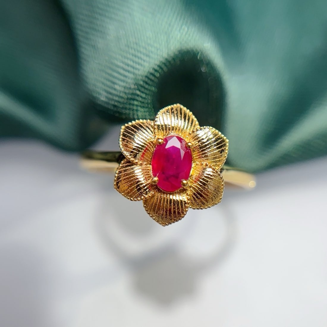 14k Gold 0.60 Ct Natural Ruby & Flowers Ring: Ref:231170266 // gold content:14k gold // ring size:7. 25us // // main gemstone:ruby // shape:oval // carat weight:0. 60ct // color:red // treatment:natural // Condition: New Low Estimate: 2600.00