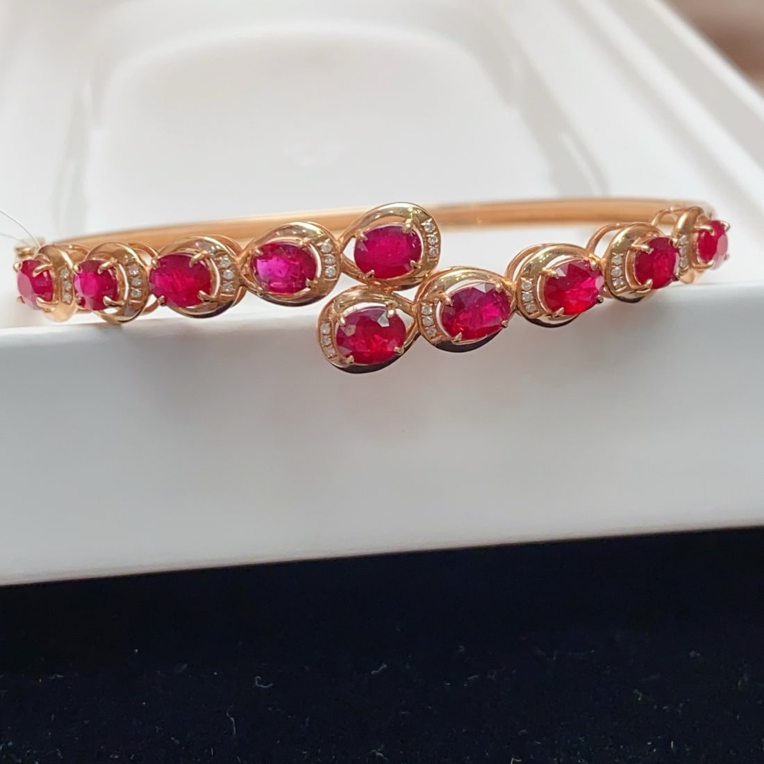 14k Gold 3.80 Ct Natural Ruby & Diamond Bangle: Ref:231170297 // gold content:14k gold // main gemstone:ruby // shape:oval // carat weight:3. 80ct // color:red // treatment:natural // // adjacent gemstone 2 : diamond // number of stones:30 // shape