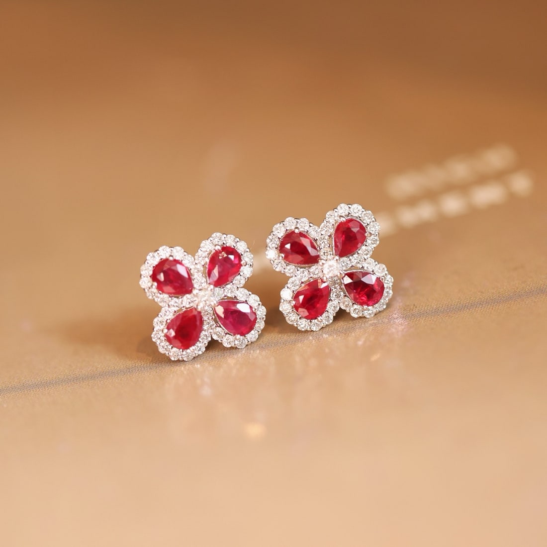 14k Gold 1.89 Ctw Vivid Red Natural Ruby & Diamond Earrings: Ref:231170299 // gold content:14k gold // main gemstone:ruby // shape:pear // carat weight:1. 46ct // color:vivid red // treatment:natural // // adjacent gemstone 2 : diamond // shape:round // carat w