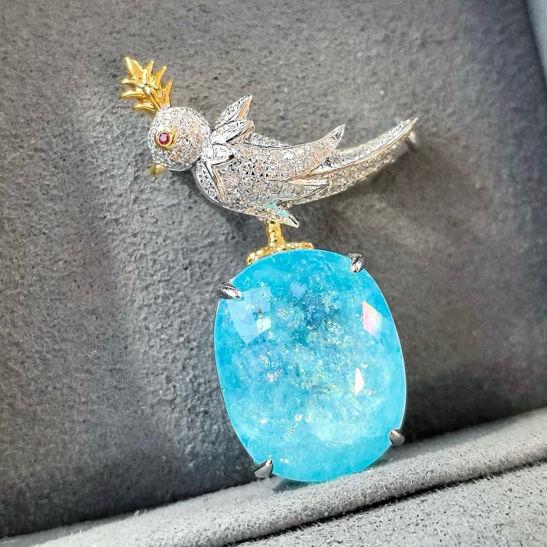 14k Gold 16.64 Ctw Natural Paraiba Tourmaline & Diamond Brooch/pendant( Without Chain ): Ref:231170317 // gold content:14k gold // main gemstone:paraiba tourmaline // shape:oval // carat weight:16. 12ct // color:neon blue // treatment:natural // // adjacent gemstone 2 : diamond //