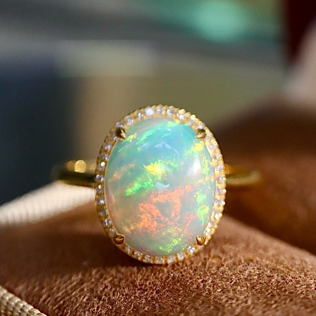 14k Gold 2.21 Ctw Natural Opal & Diamond Ring: Ref:231167134 // gold content:14k gold // ring size:7. 25us // // main gemstone:opal // shape:oval // carat weight:2. 1ct // color:color // treatment:natural // // adjacent gemstone 2 : diamond //