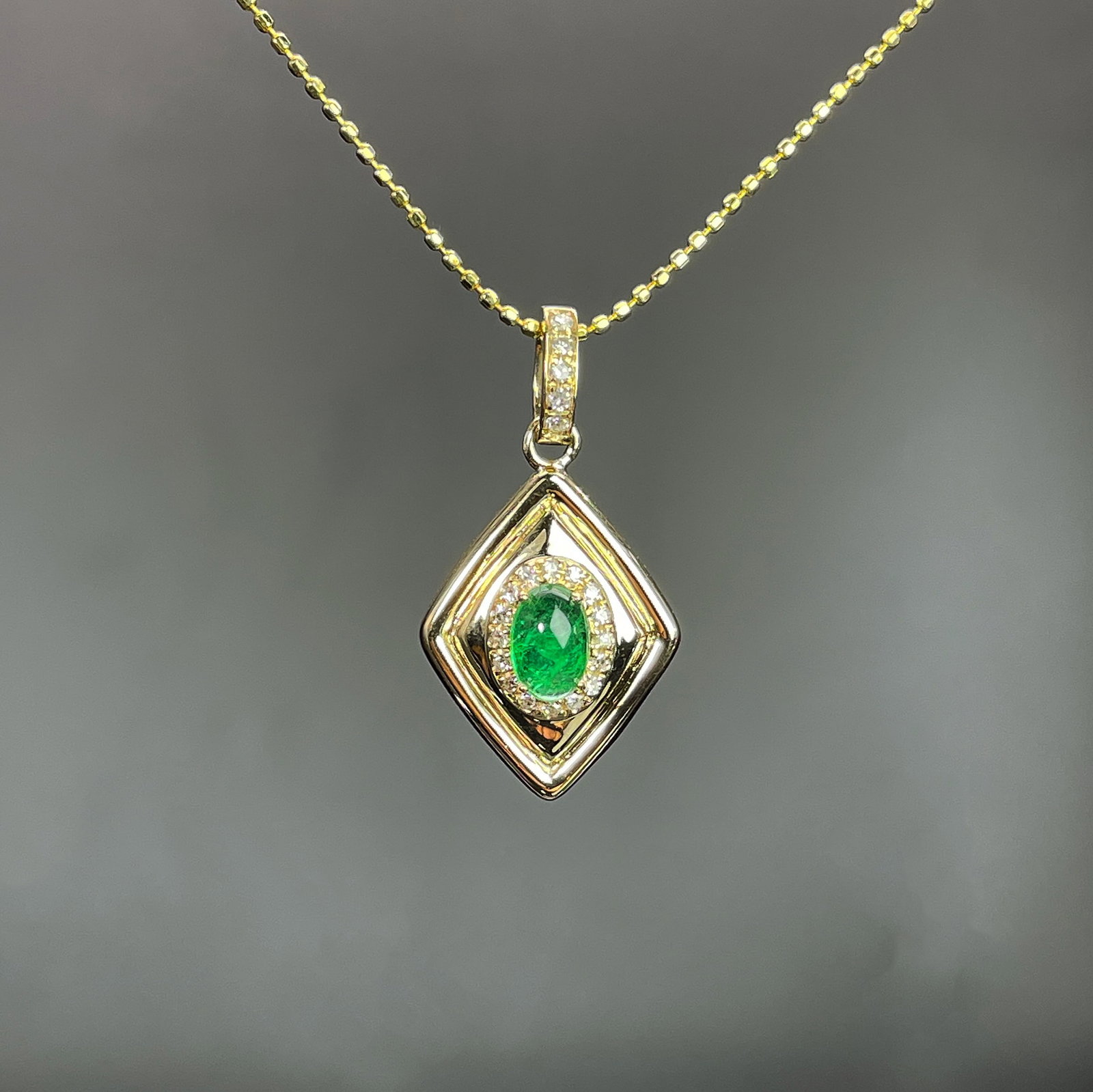 14k Gold 0.38 Ctw Natural Emerald & Diamond Pendant( Without Chain ): Ref:231168019 // gold content:14k gold // main gemstone:emerald // shape:oval // carat weight:0. 3ct // color:green // treatment:natural // // adjacent gemstone 2 : diamond // shape:round // carat