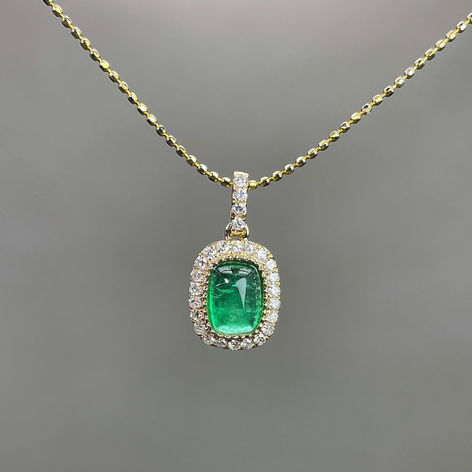 14k Gold 0.84 Ctw Natural Emerald & Diamond Pendant( Without Chain ): Ref:231168041 // gold content:14k gold // main gemstone:emerald // shape:sugar-loaf // carat weight:0. 7ct // color:green // treatment:natural // // adjacent gemstone 2 : diamond // shape:round //