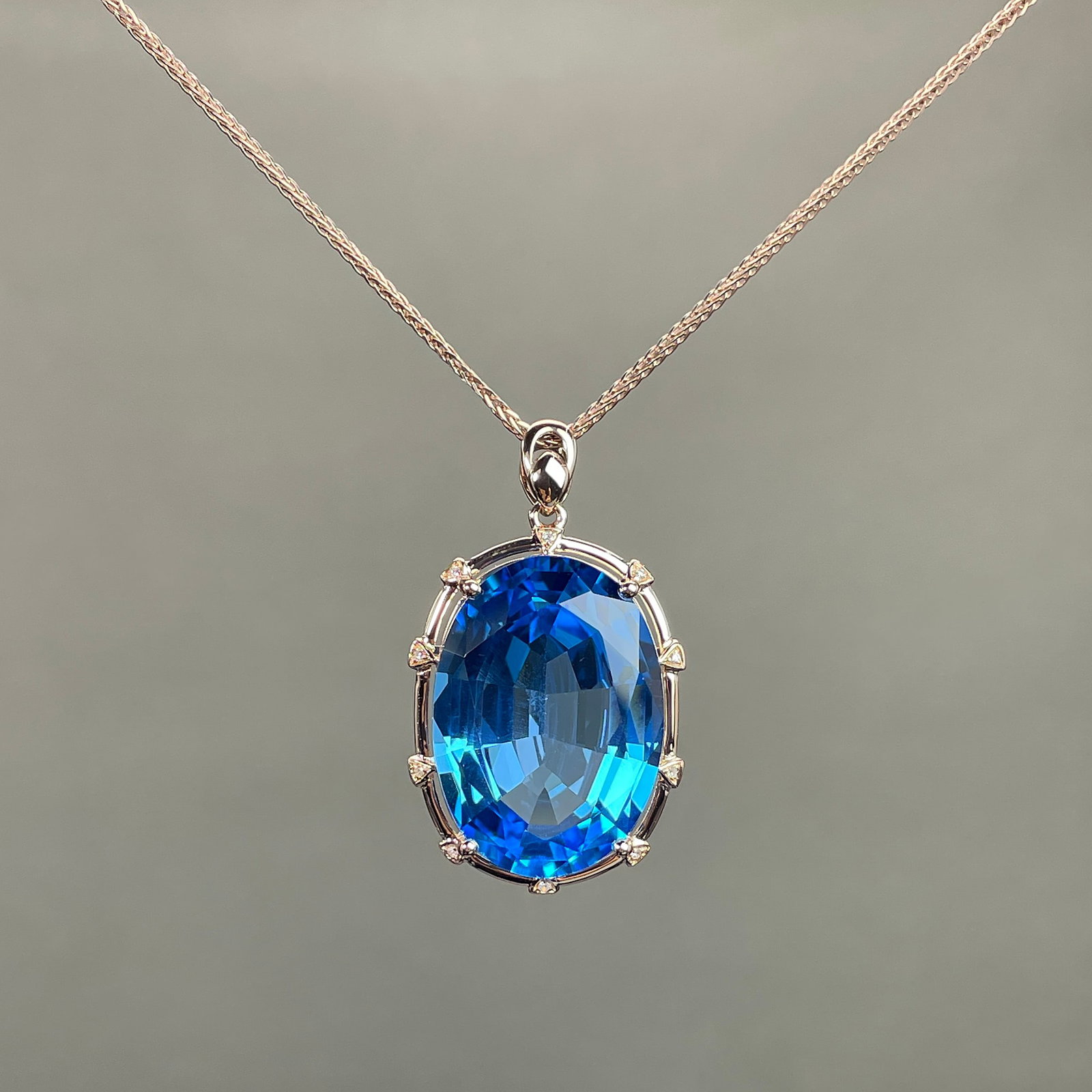 14k Gold 23.43 Ctw Natural Topaz & Diamond Pendant( Without Chain ): Ref:231168048 // gold content:14k gold // main gemstone:topaz // shape:oval // carat weight:23. 4ct // color:blue // treatment:natural // // adjacent gemstone 2 : diamond // shape:round // carat