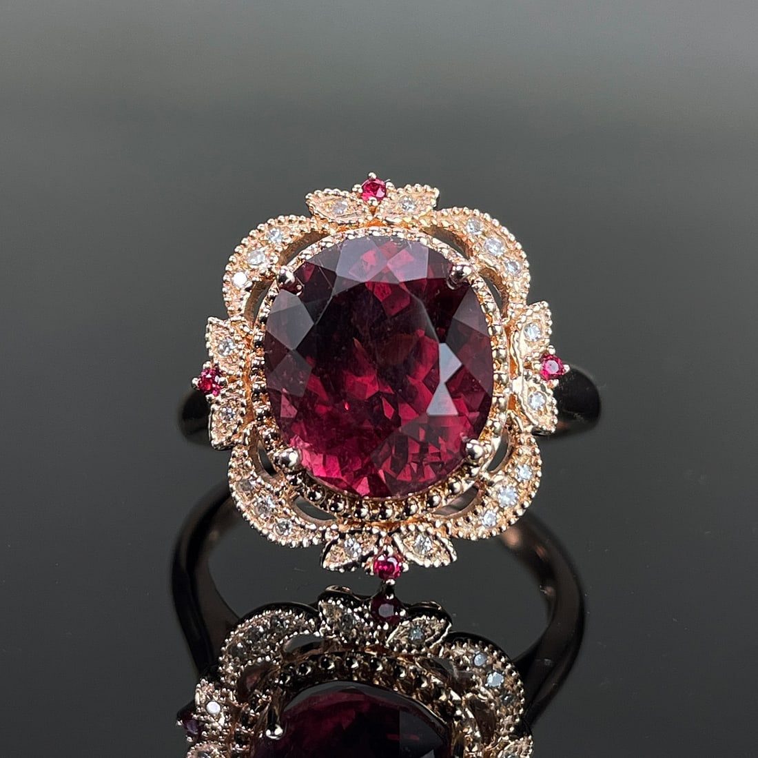 14k Gold 4.00 Ctw Natural Tourmaline & Diamond Ring: Ref:231168071 // gold content:14k gold // ring size:7. 25us // // main gemstone:tourmaline // shape:oval // carat weight:3. 9ct // color:red // treatment:natural // // adjacent gemstone 2 : diamond