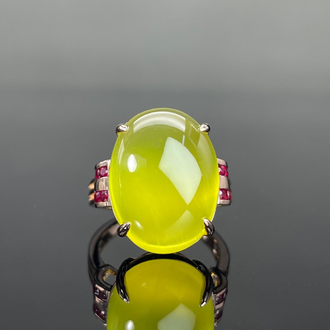14k Gold 16.15 Ctw Natural Prehnite & Ruby Ring: Ref:231168083 // gold content:14k gold // ring size:7. 25us // // main gemstone:prehnite // shape:oval // carat weight:15. 85ct // color:yellow // treatment:natural // // adjacent gemstone 2 : ruby //