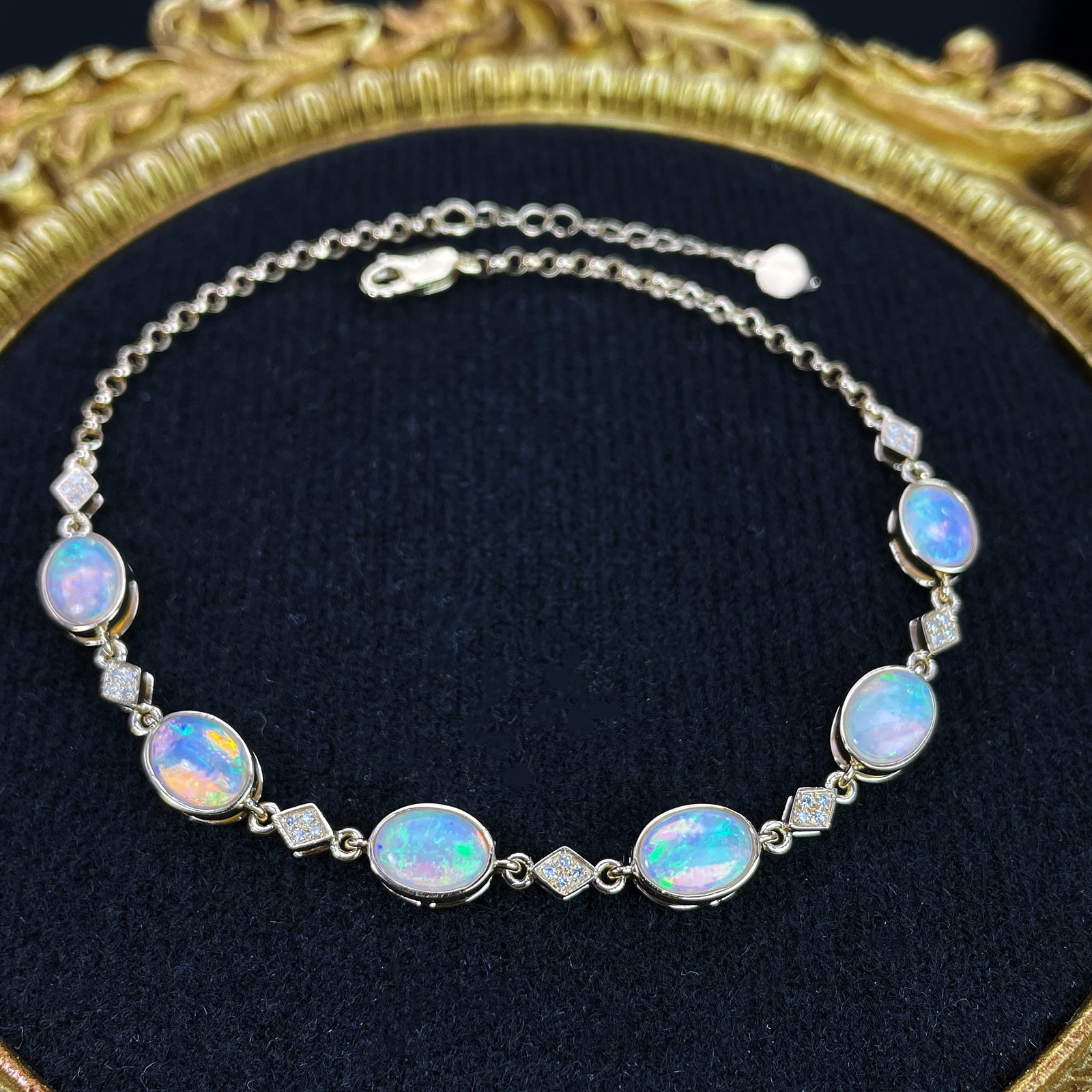 14k Gold 2.75 Ctw Natural Opal & Diamond Bracelet: Ref:231168098 // gold content:14k gold // main gemstone:opal // shape:oval // carat weight:2. 67ct // color:color // treatment:natural // // adjacent gemstone 2 : diamond // shape:round // carat