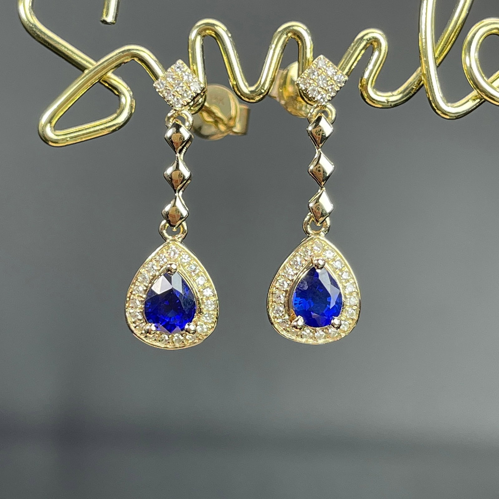 14k Gold 0.81 Ctw Natural Sapphire & Diamond Earrings: Ref:231168119 // gold content:14k gold // main gemstone:sapphire // shape:pear // carat weight:0. 66ct // color:blue // treatment:natural // // adjacent gemstone 2 : diamond // shape:round // carat
