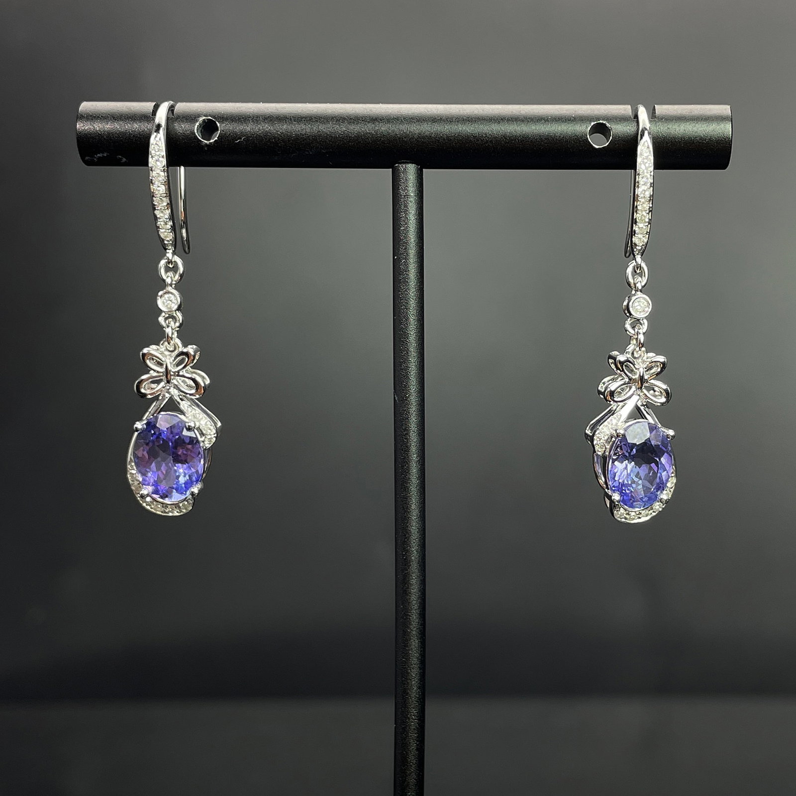 14k Gold 2.85 Ctw Natural Tanzanite & Diamond Earrings: Ref:231168142 // gold content:14k gold // main gemstone:tanzanite // shape:oval // carat weight:2. 62ct // color:blue // treatment:natural // // adjacent gemstone 2 : diamond // shape:round // carat