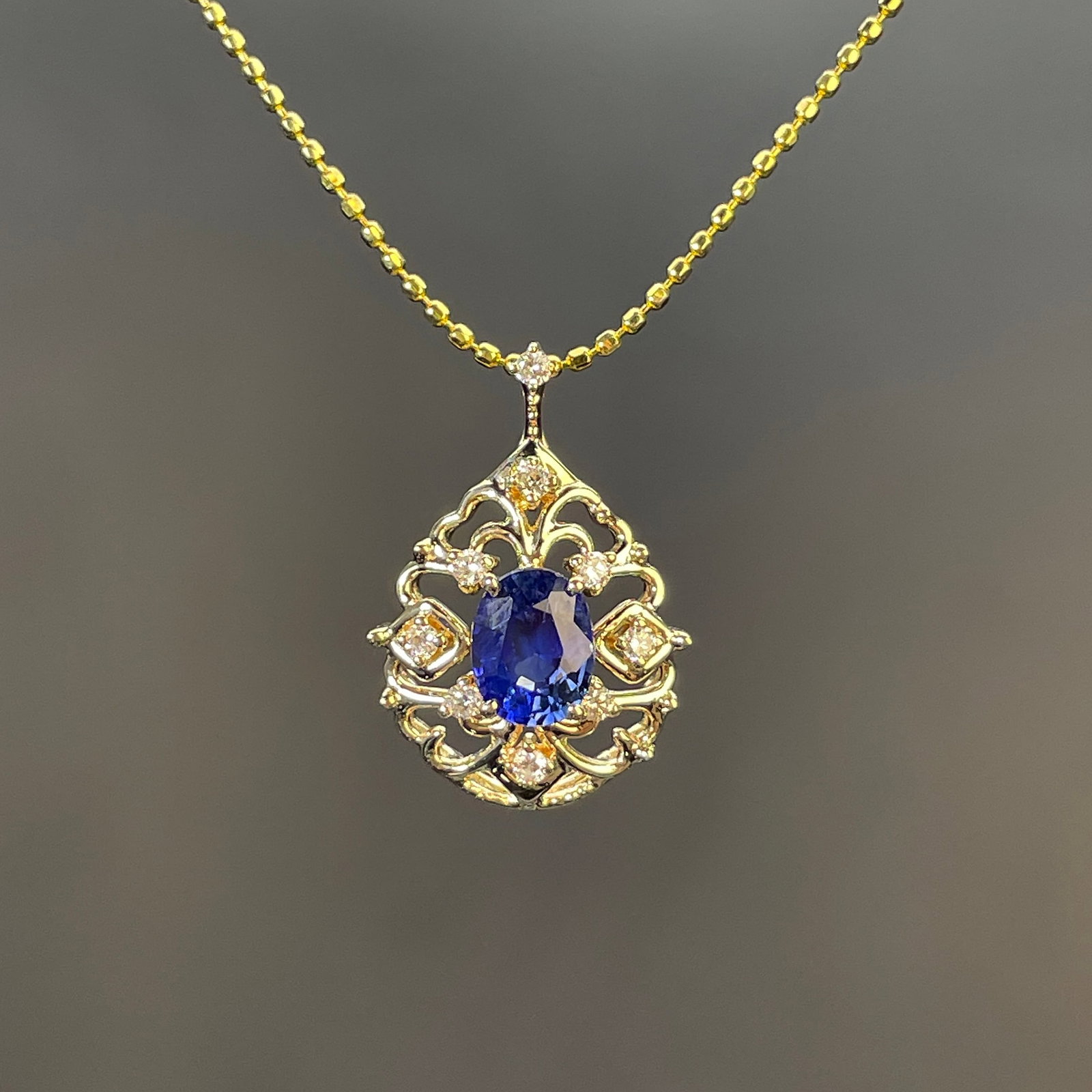 14k Gold 0.68 Ctw Natural Sapphire & Diamond Pendant( Without Chain ): Ref:231168178 // gold content:14k gold // main gemstone:sapphire // shape:oval // carat weight:0. 55ct // color:blue // treatment:natural // // adjacent gemstone 2 : diamond // shape:round // carat
