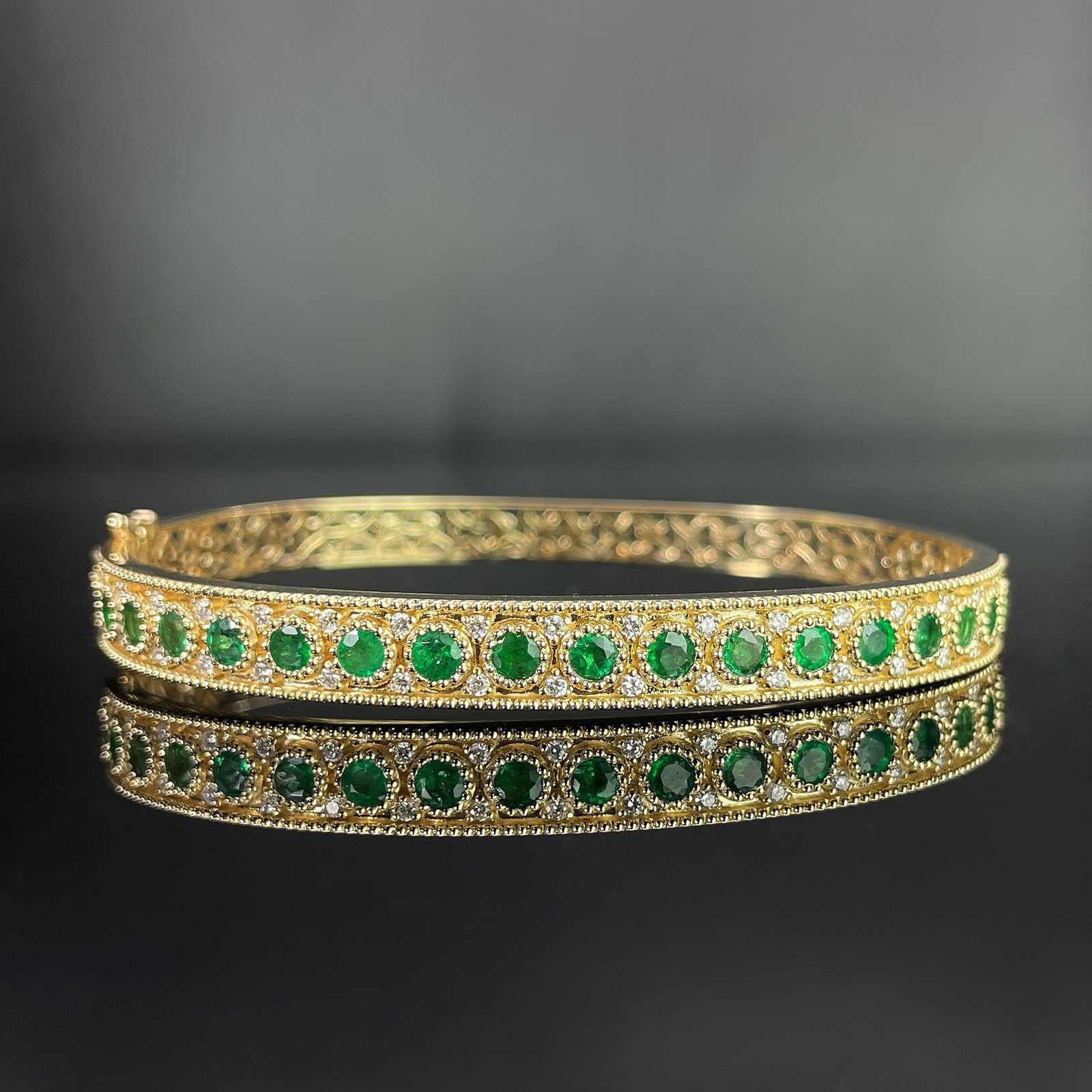 14k Gold 2.24 Ctw Natural Emerald & Diamond Bangle: Ref:231168188 // gold content:14k gold // main gemstone:emerald // shape:round // carat weight:1. 82ct // color:green // treatment:natural // cut grade:g // // adjacent gemstone 2 : diamond //