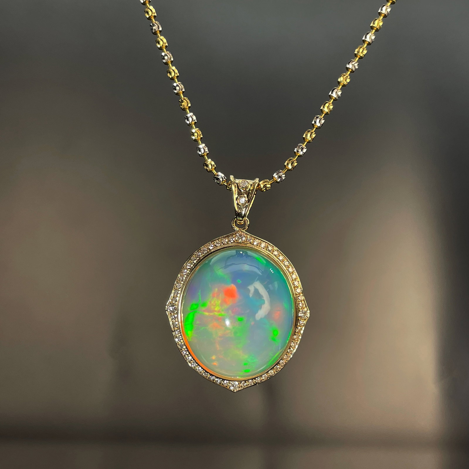 14k Gold 13.95 Ctw Natural Opal & Diamond Pendant( Without Chain ): Ref:231168210 // gold content:14k gold // main gemstone:opal // shape:oval // carat weight:13. 45ct // color:color // treatment:natural // // adjacent gemstone 2 : diamond // shape:round // carat