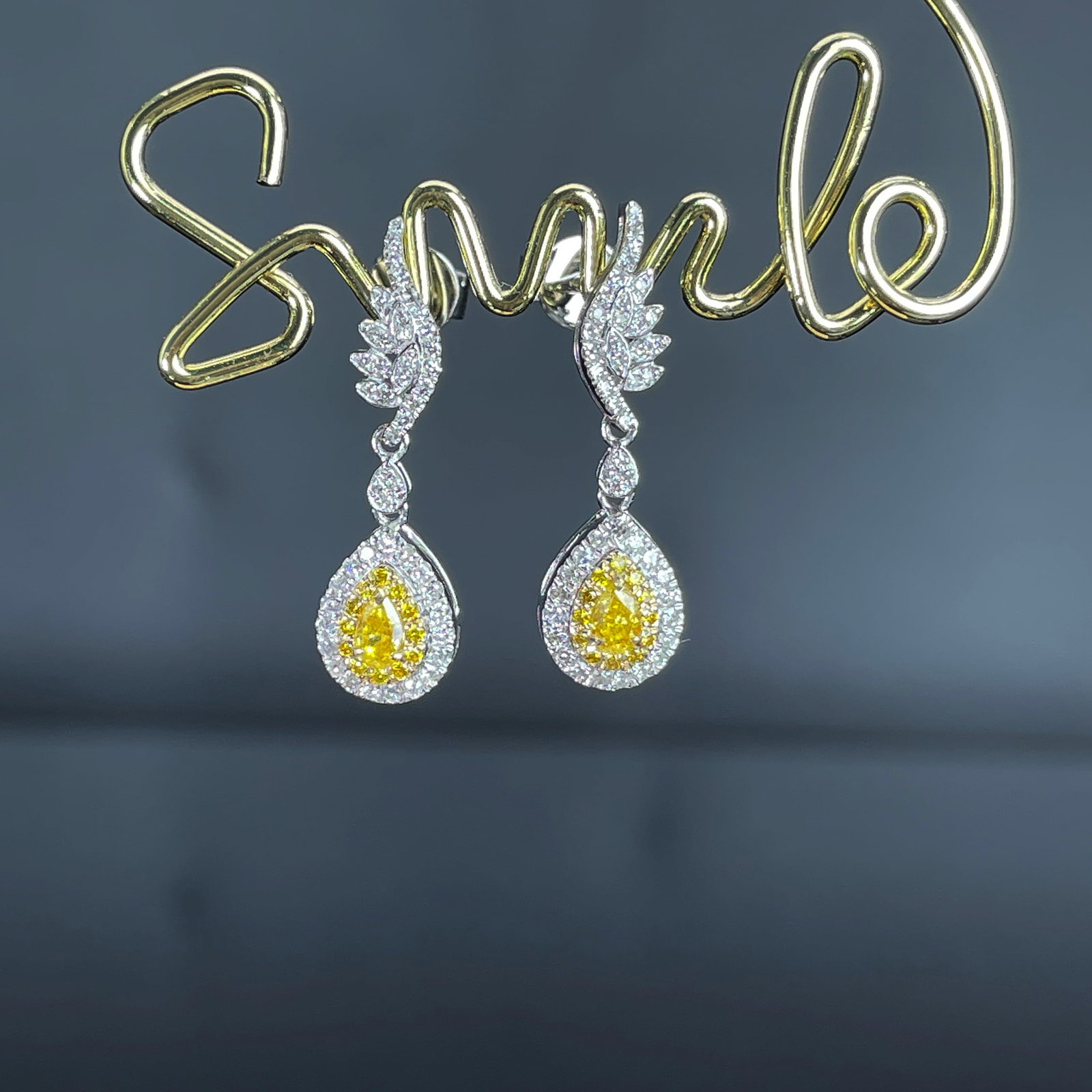 14k Gold 0.62 Ctw Natural Yellow Diamond & Diamond Earrings: Ref:231168214 // gold content:14k gold // main gemstone:yellow diamond // shape:pear // carat weight:0. 2ct // color:yellow // treatment:natural // // adjacent gemstone 2 : diamond // shape:round //
