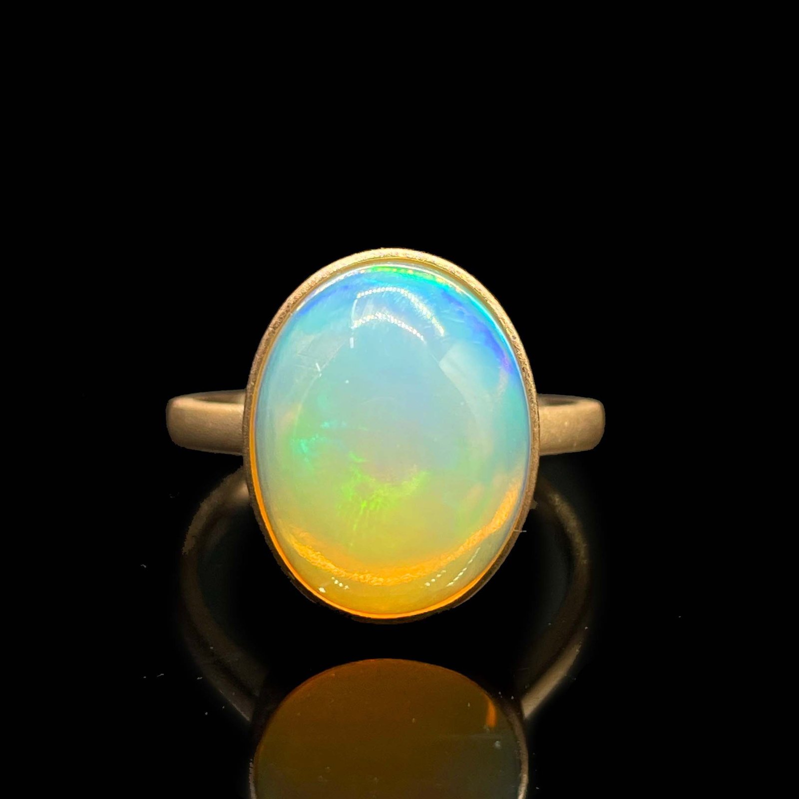 14k Gold 3.8 Ct Natural Opal Ring: Ref:231168331 // gold content:14k gold // ring size:7. 25us // // main gemstone:opal // shape:oval // carat weight:3. 8ct // color:color // treatment:natural // Condition: New Low Estimate: 1100.00