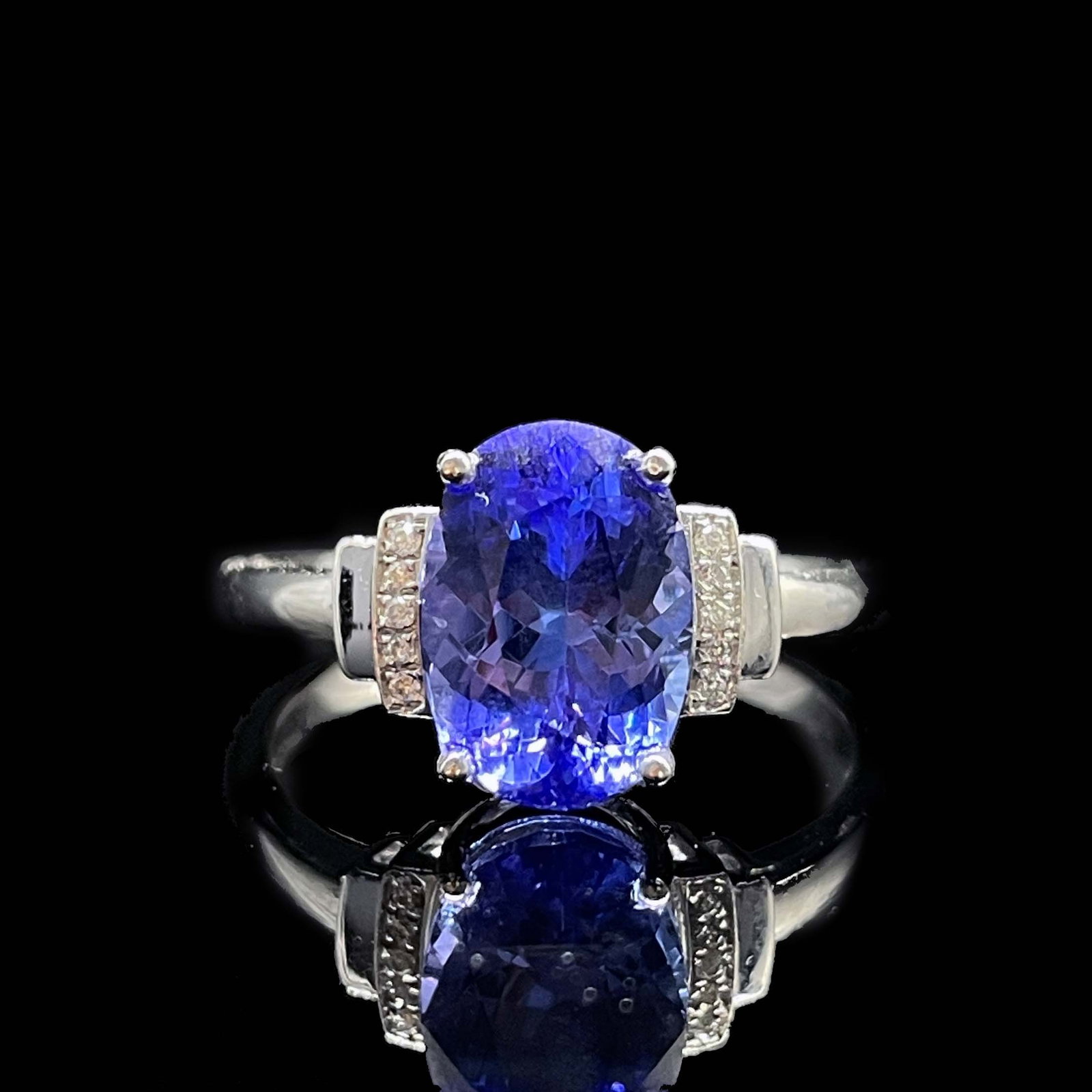 14k Gold 2.50 Ctw Natural Tanzanite & Diamond Ring: Ref:231168344 // gold content:14k gold // ring size:7. 25us // // main gemstone:tanzanite // shape:oval // carat weight:2. 45ct // color:blue // treatment:natural // // adjacent gemstone 2 : diamond
