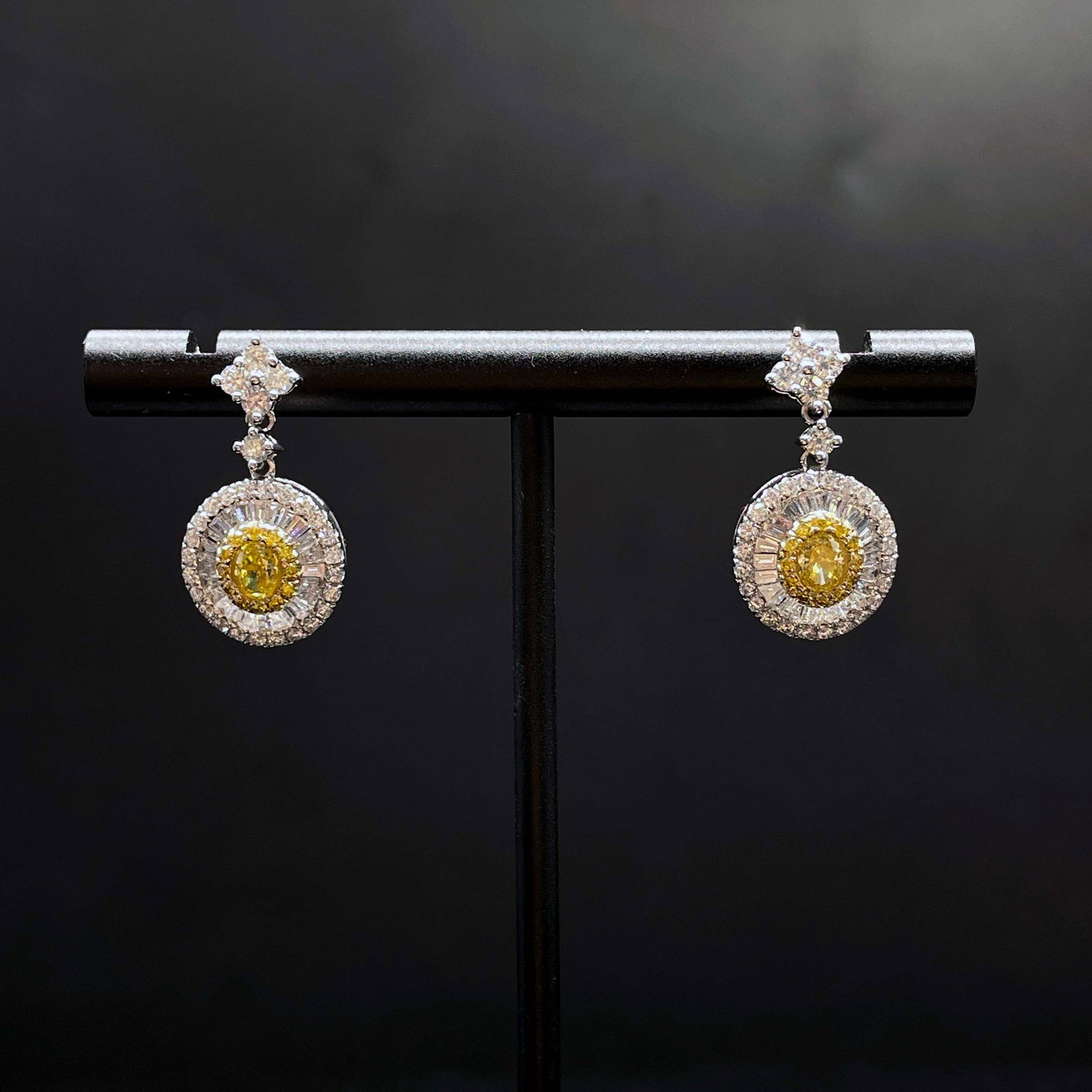 14k Gold 1.32 Ct Natural Color Diamond Earrings: Ref:231168355 // gold content:14k gold // main gemstone:diamond // shape:multiple // carat weight:1. 32ct // clarity grade:vs-si // color:color // treatment:natural // Condition: New Low Estimate: 400