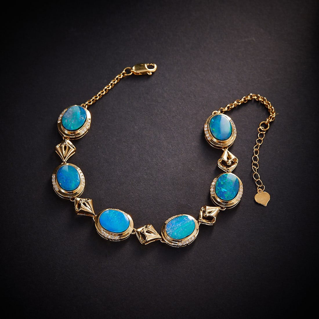 14k Gold 7.00 Ctw Natural Opal & Diamond Bracelet: Ref:231168437 // gold content:14k gold // main gemstone:opal // shape:oval // carat weight:6. 75ct // color:color // treatment:natural // // adjacent gemstone 2 : diamond // shape:round // carat