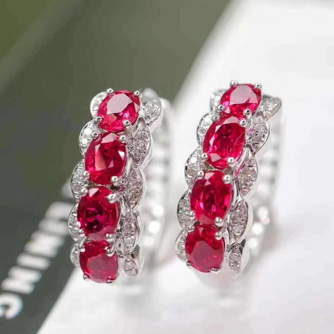 14k Gold 2.40 Ctw Natural Ruby & Diamond Earrings: Ref:231171030 // gold content:14k gold // main gemstone:ruby // shape:oval // carat weight:2. 28ct // color:red // treatment:natural // // adjacent gemstone 2 : diamond // shape:round // carat weight: