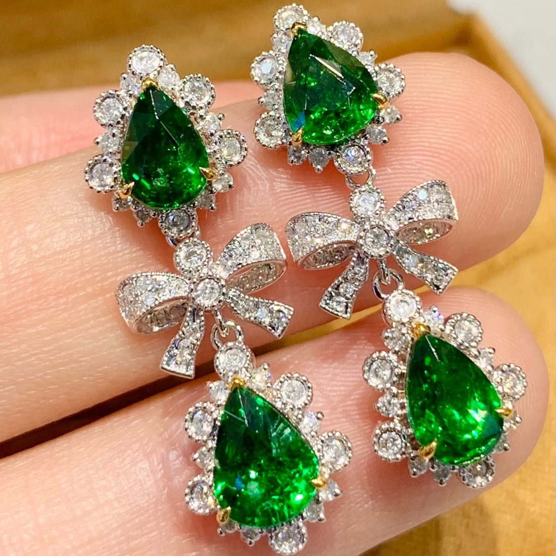 14k Gold 4.2 Ct Vivid Green Natural Tsavorite & Diamond Earrings: Ref:231171061 // gold content:14k gold // main gemstone:tsavorite // shape:pear // carat weight:4. 2ct // color:vivid green // treatment:natural // // adjacent gemstone 2 : diamond // shape:round //
