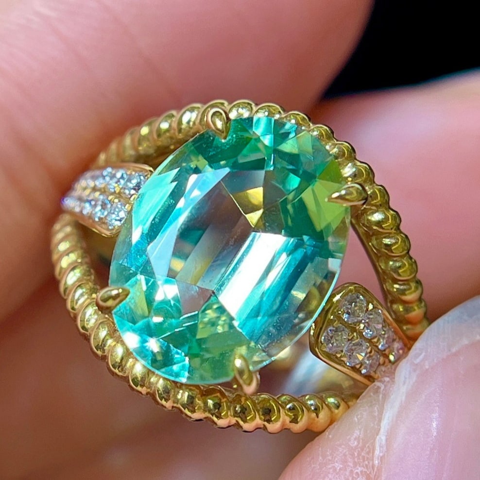 14k Gold 4.76 Ctw Natural Tourmaline & Diamond Ring: Ref:231171064 // gold content:14k gold // ring size:7. 25us // // main gemstone:tourmaline // shape:oval // carat weight:4. 55ct // color:green // treatment:natural // // adjacent gemstone 2 : diamond