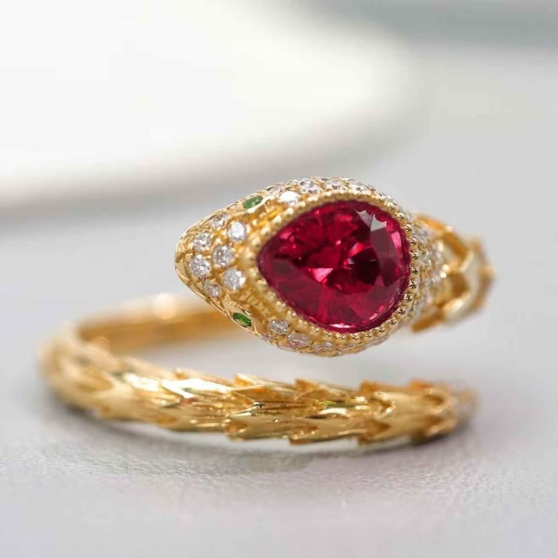 14k Gold 0.97 Ctw Vivid Red Natural Ruby & Diamond & Snake Ring: Ref:231171132 // gold content:14k gold // ring size:7. 25us // // main gemstone:ruby // shape:pear // carat weight:0. 75ct // color:vivid red // treatment:natural // // adjacent gemstone 2 : diamond /
