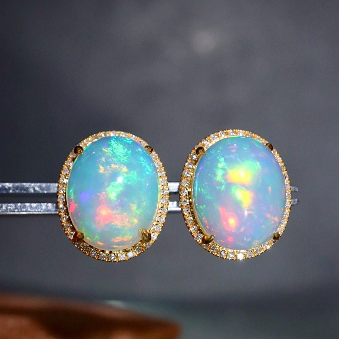 14k Gold 5.03 Ctw Natural Opal & Diamond Earrings: Ref:231171223 // gold content:14k gold // main gemstone:opal // shape:oval // carat weight:4. 8ct // color:color // treatment:natural // // adjacent gemstone 2 : diamond // shape:round // carat