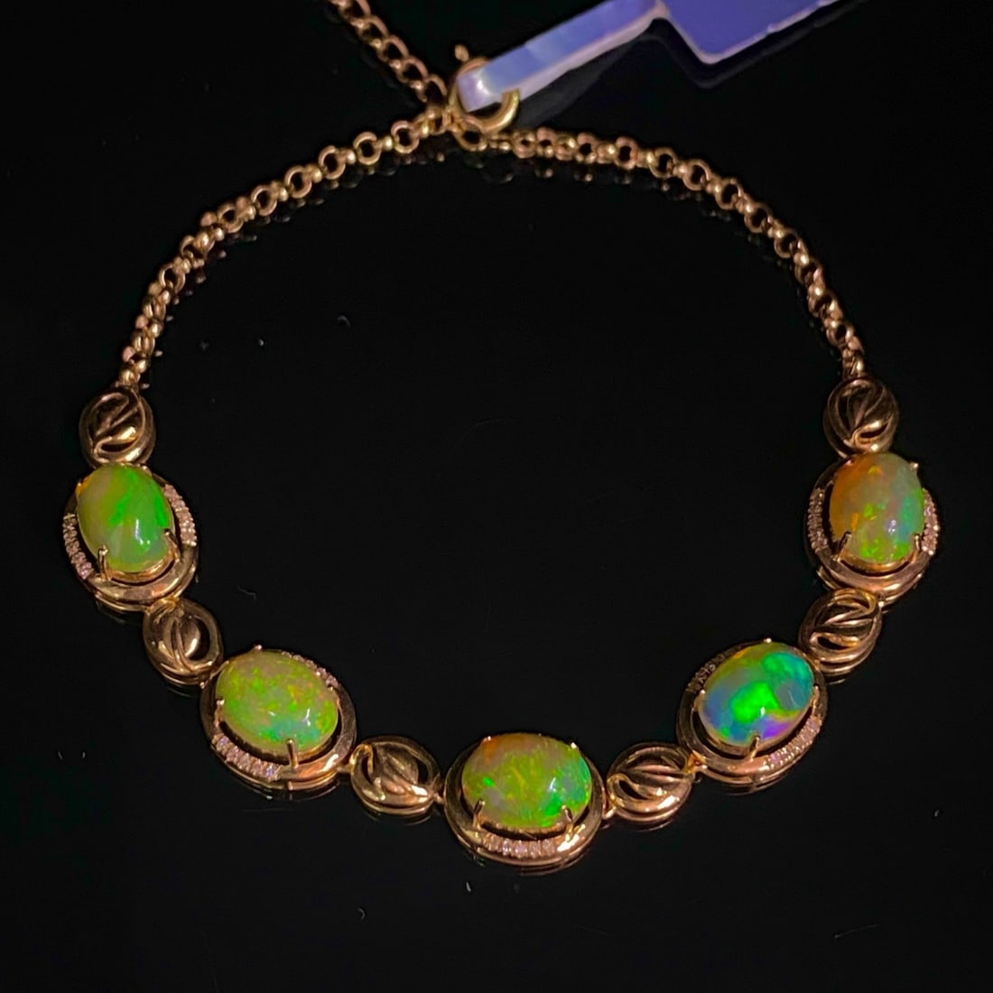 14k Gold 4.05 Ct Natural Opal & Diamond Bracelet: Ref:231171225 // gold content:14k gold // main gemstone:opal // shape:oval // carat weight:4. 05ct // color:color // treatment:natural // // adjacent gemstone 2 : diamond // number of stones:50 //