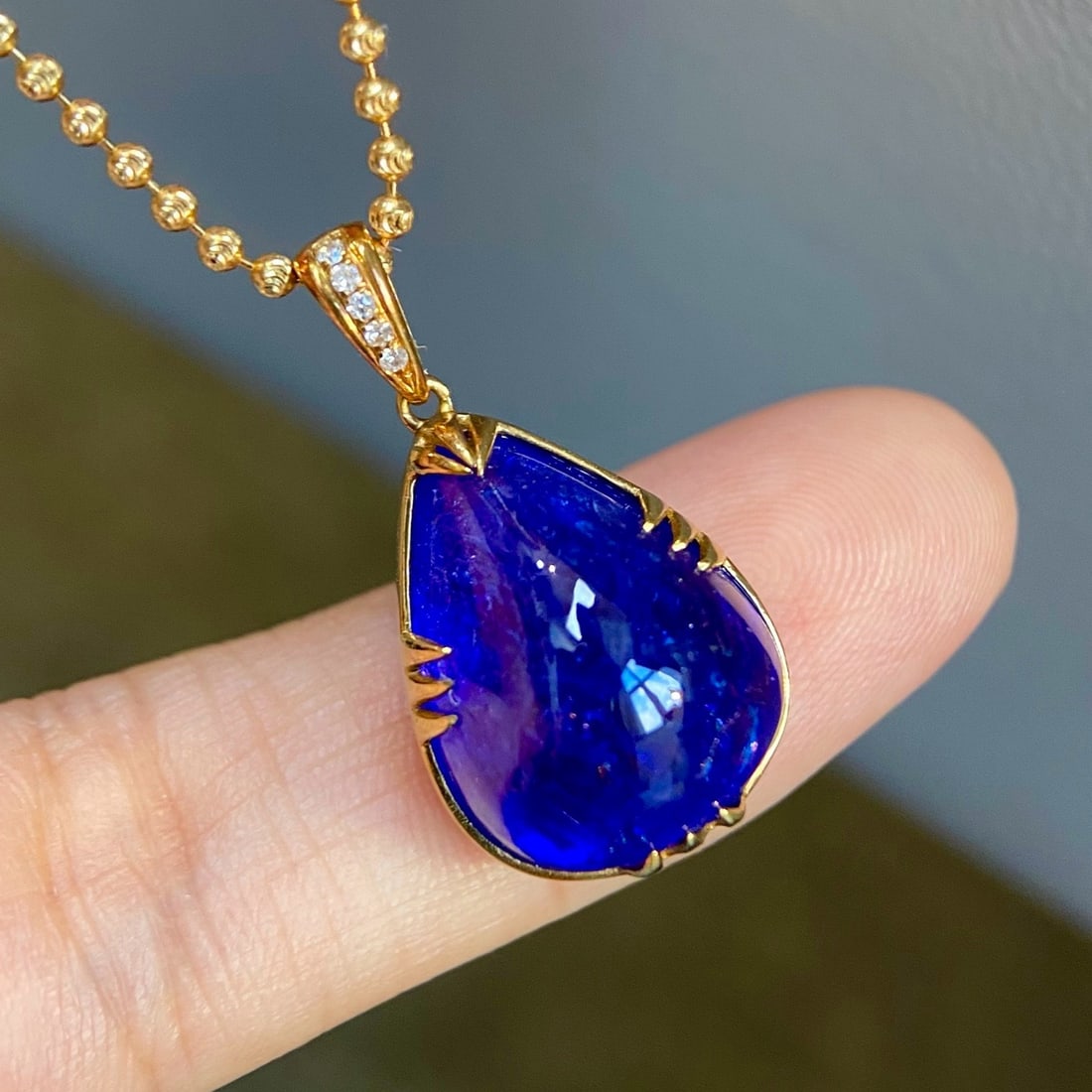 14k Gold 14.55 Ct Natural Tanzanite & Diamond Pendant( Without Chain ): Ref:231172104 // gold content:14k gold // main gemstone:tanzanite // shape:pear // carat weight:14. 55ct // color:blue // treatment:natural // // adjacent gemstone 2 : diamond // shape:round //