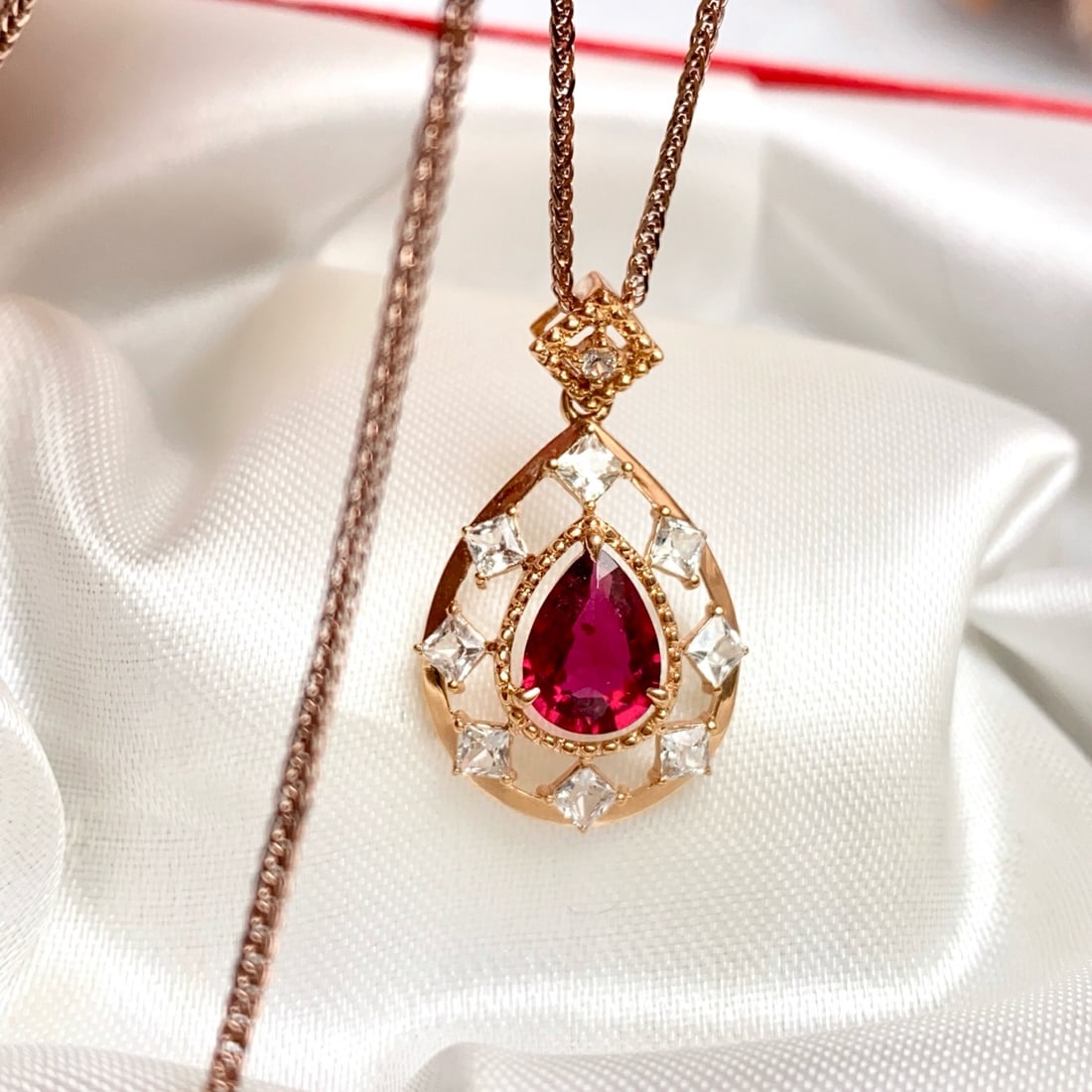 14k Gold 1.20 Ct Natural Tourmaline & Sapphire Pendant( Without Chain ): Ref:231172240 // gold content:14k gold // main gemstone:tourmaline // shape:pear // carat weight:1. 20ct // color:red // treatment:natural // // adjacent gemstone 2 : sapphire // number of stones:9