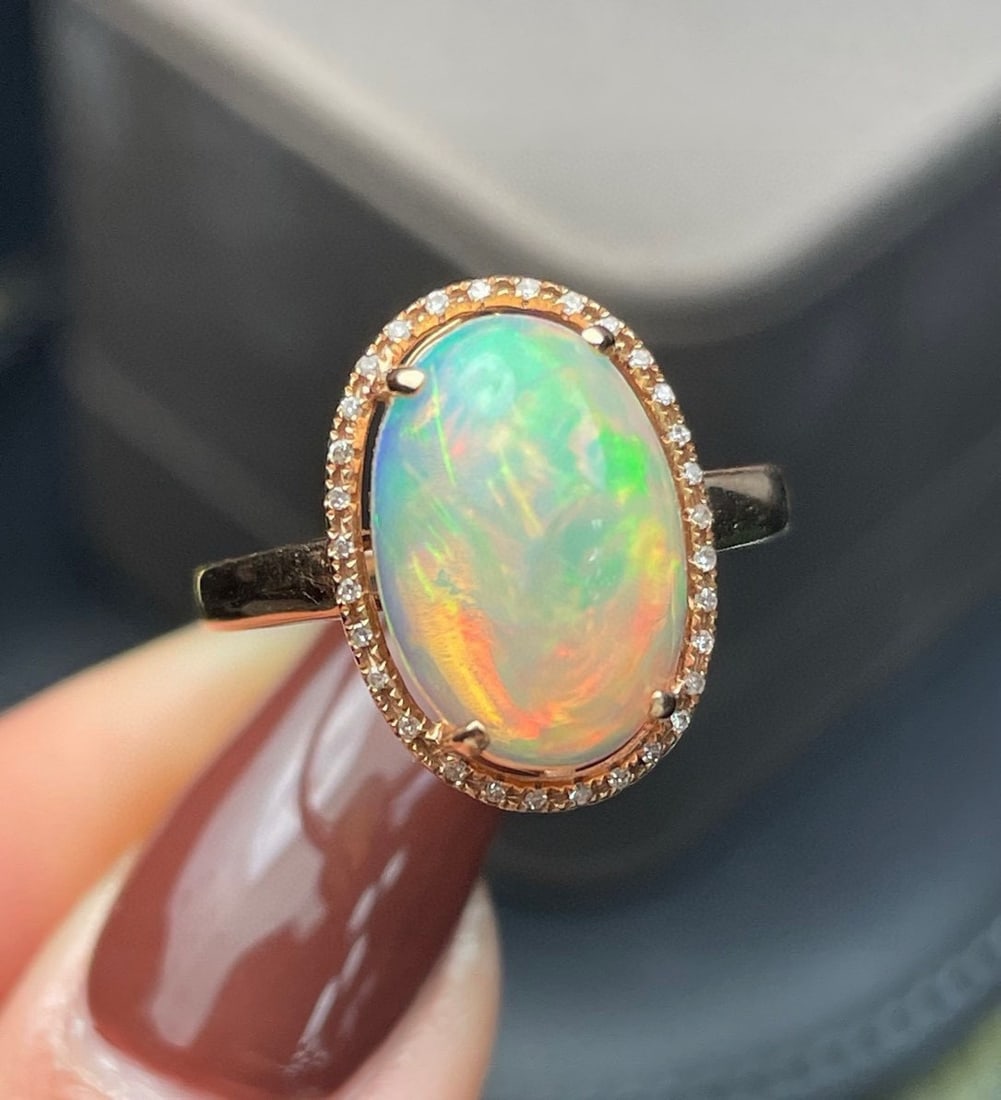 14k Gold 4.07 Ct Natural Opal & Diamond Ring: Ref:231172272 // gold content:14k gold // ring size:7. 25us // // main gemstone:opal // shape:oval // carat weight:4. 07ct // color:color // treatment:natural // // adjacent gemstone 2 : diamond //