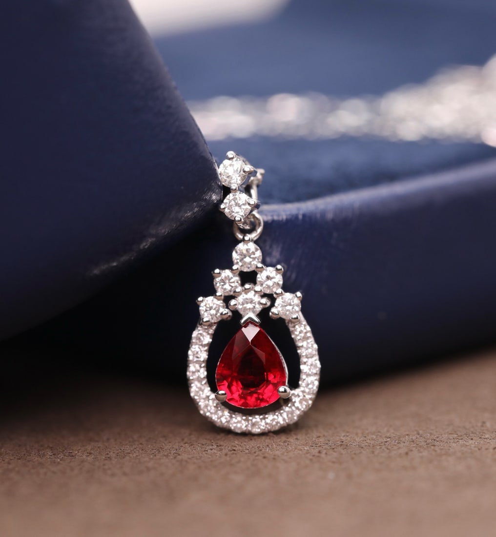 14k Gold 0.79 Ctw Natural Ruby & Diamond Pendant( Without Chain ): Ref:231172277 // gold content:14k gold // main gemstone:ruby // shape:pear // carat weight:0. 55ct // color:red // treatment:natural // // adjacent gemstone 2 : diamond // shape:round // carat